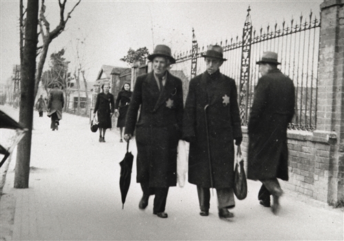 Greece 1942-1943. Salonika, Jew ghetto. Two elderly Jews walking down a ...